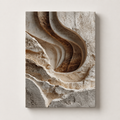Carved textured canvas wall art in warm neutral earth tones, shown as a vertical stretched canvas on a clean light background